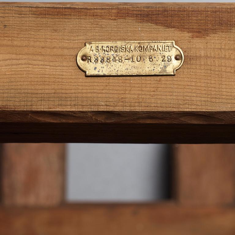 Axel Einar Hjorth, a red limestone top and stained pine side table, Nordiska Kompaniet, Sweden 1929.