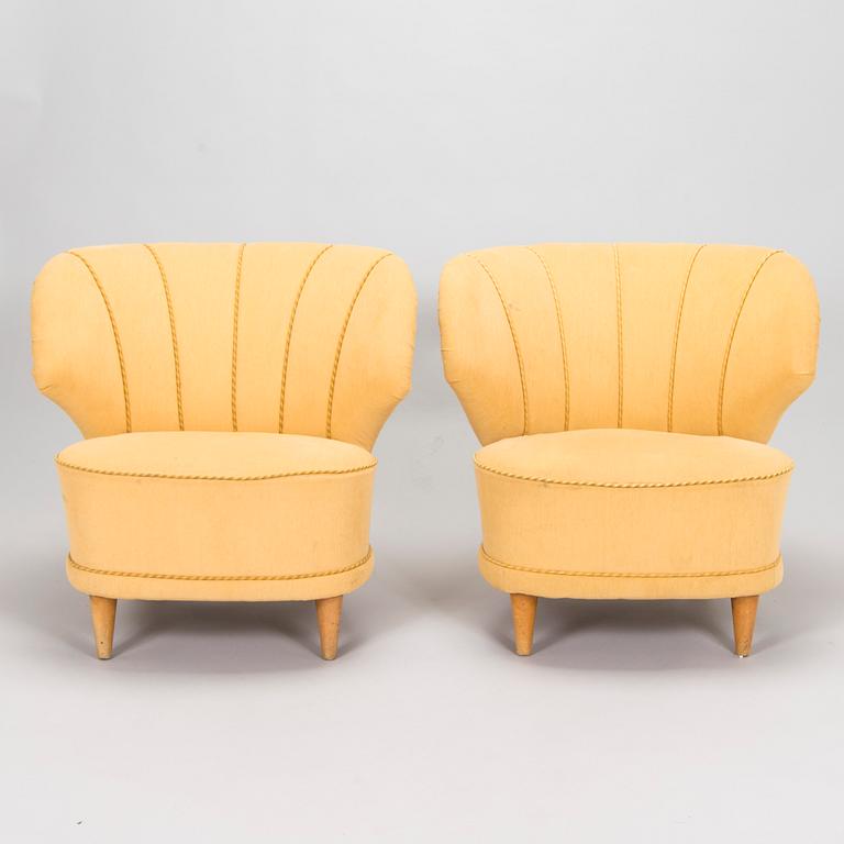A pair of mid-20th century armchairs.