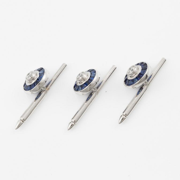 Three shirt buttons in 18K and 14K white gold set with faceted sapphires and round brilliant-cut diamonds.