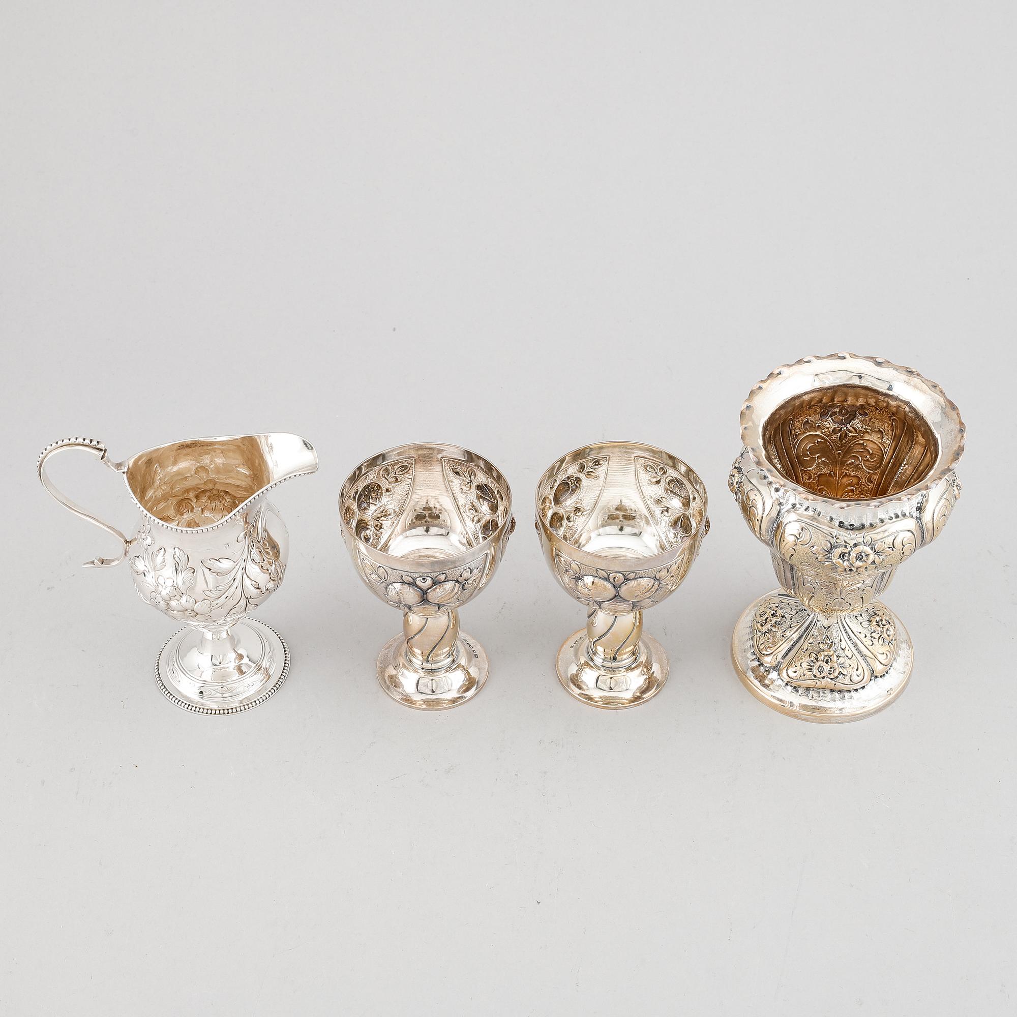 A mixed lot of two beakers, a vase and a jug, Baroque style, silver 830, 20th century.