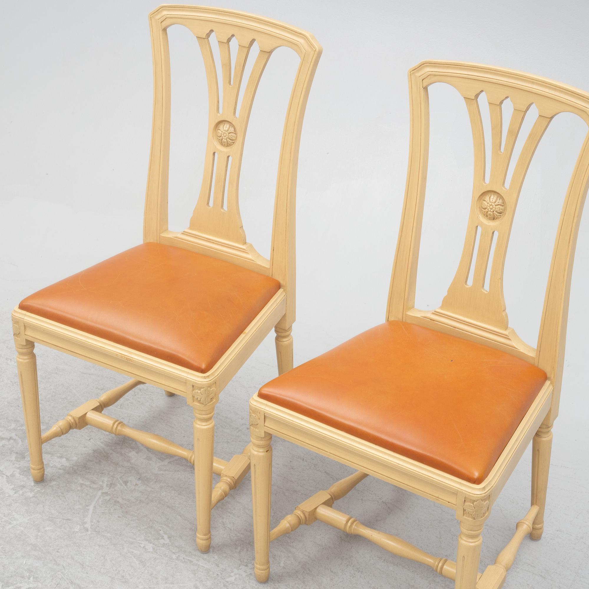A Gustavian style dining table with six dining chairs, Sweden, 21st century.