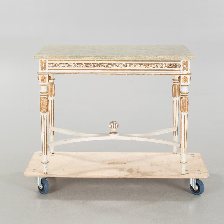 A late gustavian style table, around the year 1900.