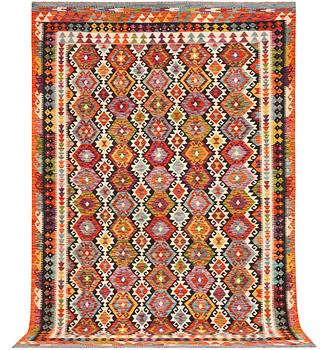 An Afghan Kilim carpet, c. 298 x 202 cm.