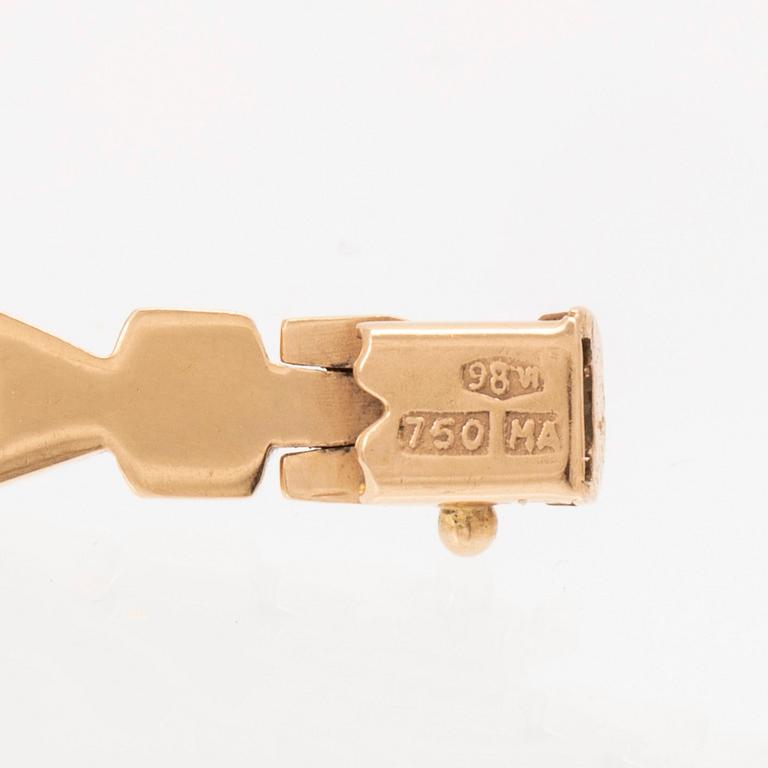 An 18K gold bracelet.