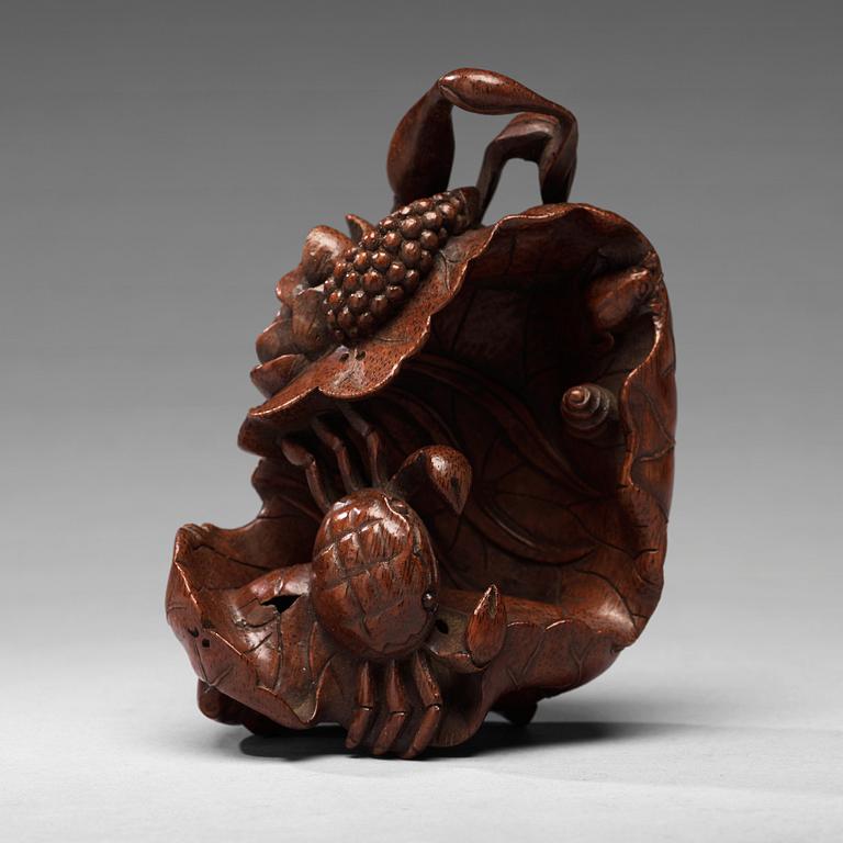 A bamboo carving of a crab and lotus, late Qing dynasty.
