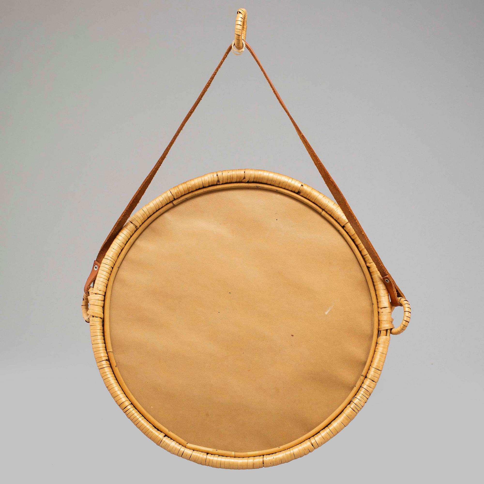 A 1960s rattan frame mirror , possibly Ikea.