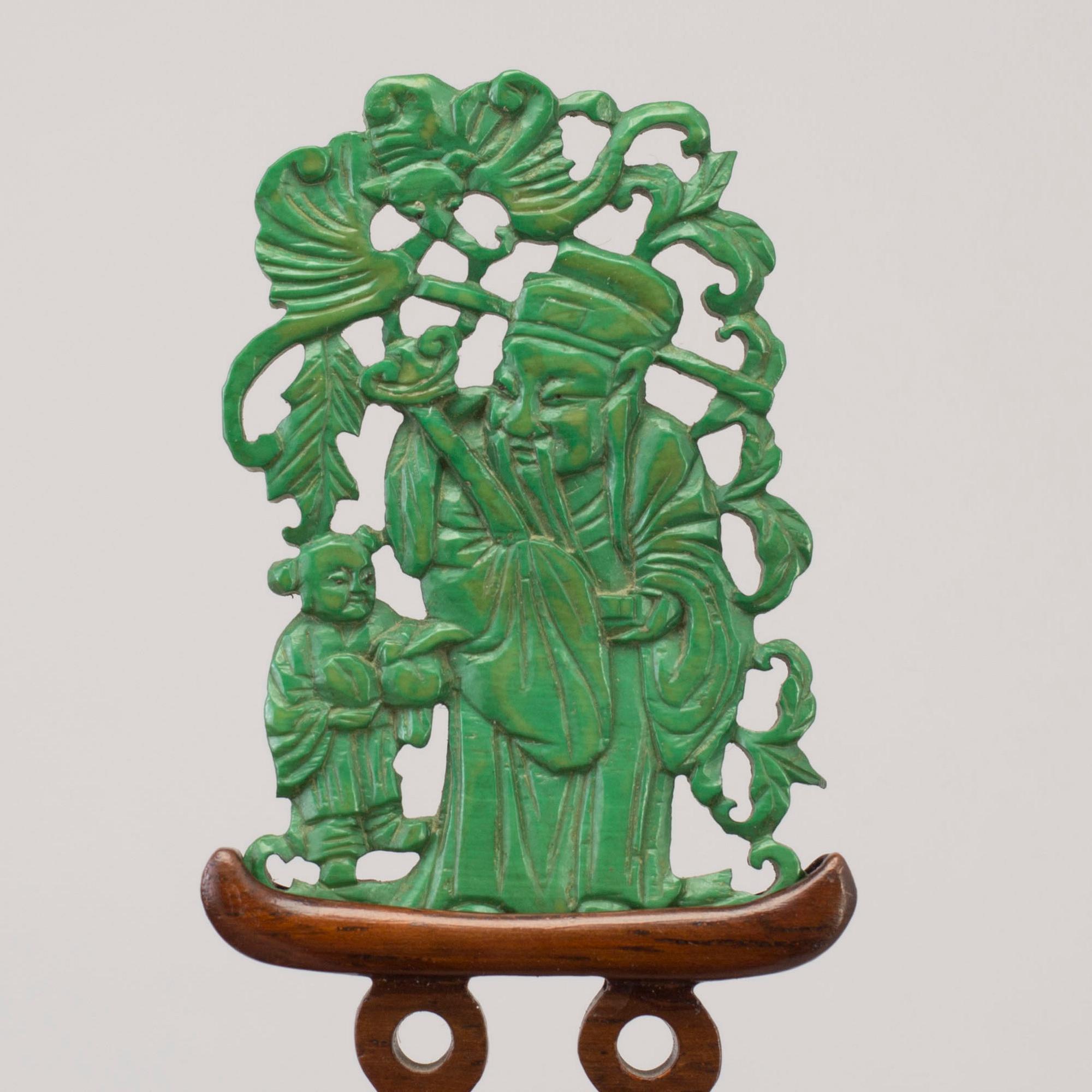 Three Chinese 20th century sculptures on stand, wood and agathe.