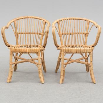 A pair of second half of the 20th century rattan easy chairs.