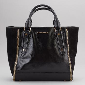 BURBERRY,  a black patent leather and suede handbag.