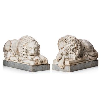 173. A pair of white marble lions, 19th century, after A Canovas model in St Peters church.