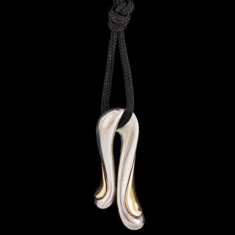 A silver and gold pendant by Minas Spiridis for Georg Jensen, designed in the 1990's.