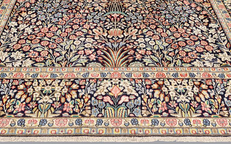 A 'Millefleur' Kerman Laver carpet, c. 410 x 290 cm.