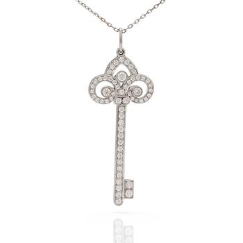 A 'Fleur de lis key' pendant set with round, brilliant-cut diamonds by Tiffany together with a chain.