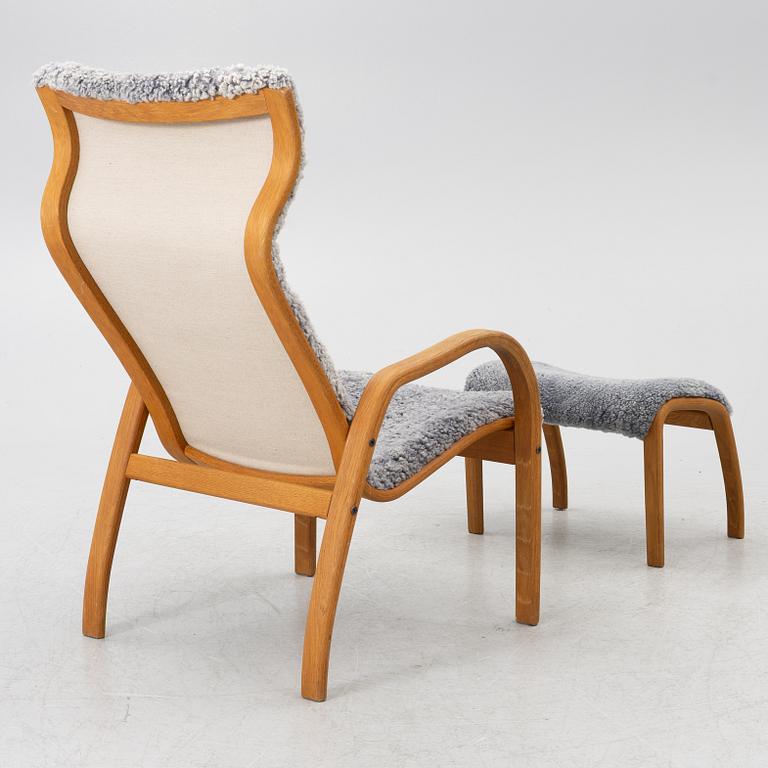 Jan Ekström, armchair with footstool "Gazelle", Conform, 21st century.