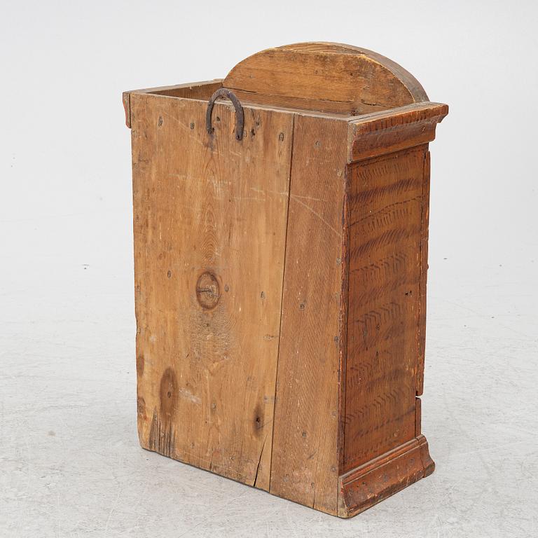 A hanging cabinet, dated 1850.