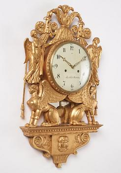 A late Gustavian giltwood cartel clock by J. Kock (royal watchmaker, active 1762-1803).