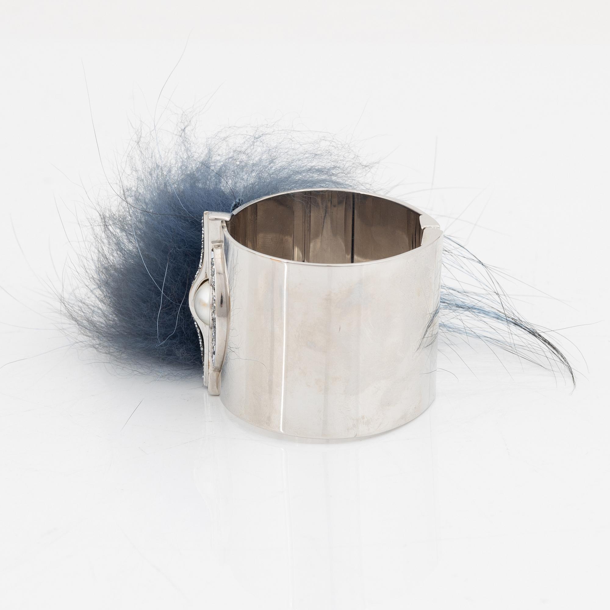 Fendi, a silvertone metal, rhinestone and fur bracelet.