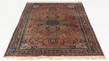 An oriental rug, circa 245 x 136 cm.
