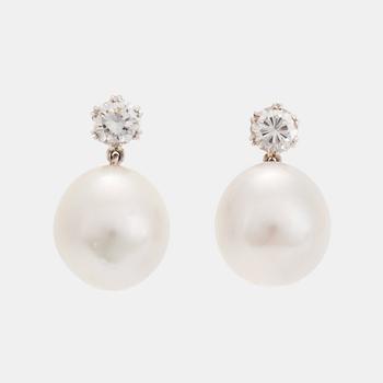 A pair of 18K white gold earrings set with round brilliant-cut diamonds and cultured pearls.