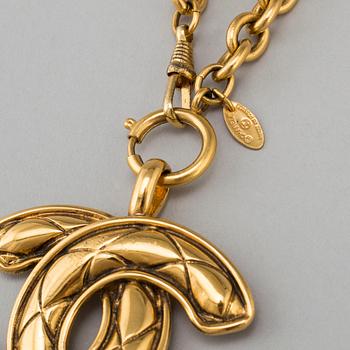 CHANEL, a metal necklace/belt.