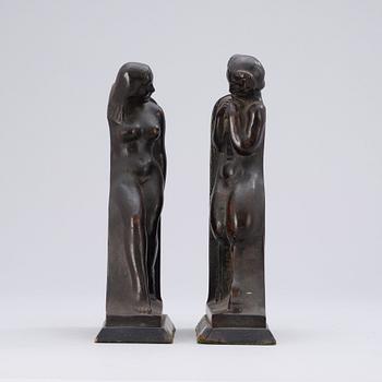 A pair of Axel Gute patinated bronze bookends, Sweden 1919.