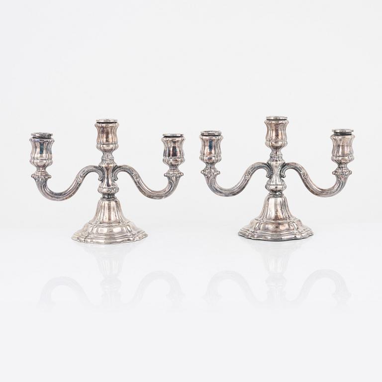 A pair of German 20 century silver candelabras with Swedish import stamp and mark 925 sterling.