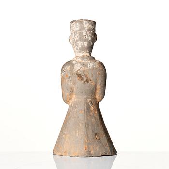 A pottery figure of a standing male figure, Han dynasty (206 BC - 220 AD).