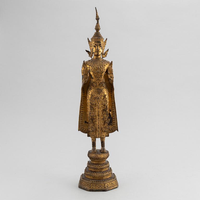 A Thai gilt bronze of standing Buddha Sakyamuni, 19th Century.