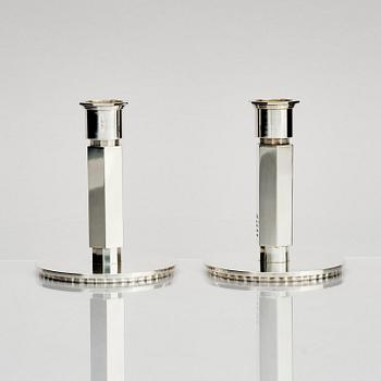 Wiwen Nilsson, a pair of sterling silver candlesticks, Lund, Sweden 11957 and 1960.