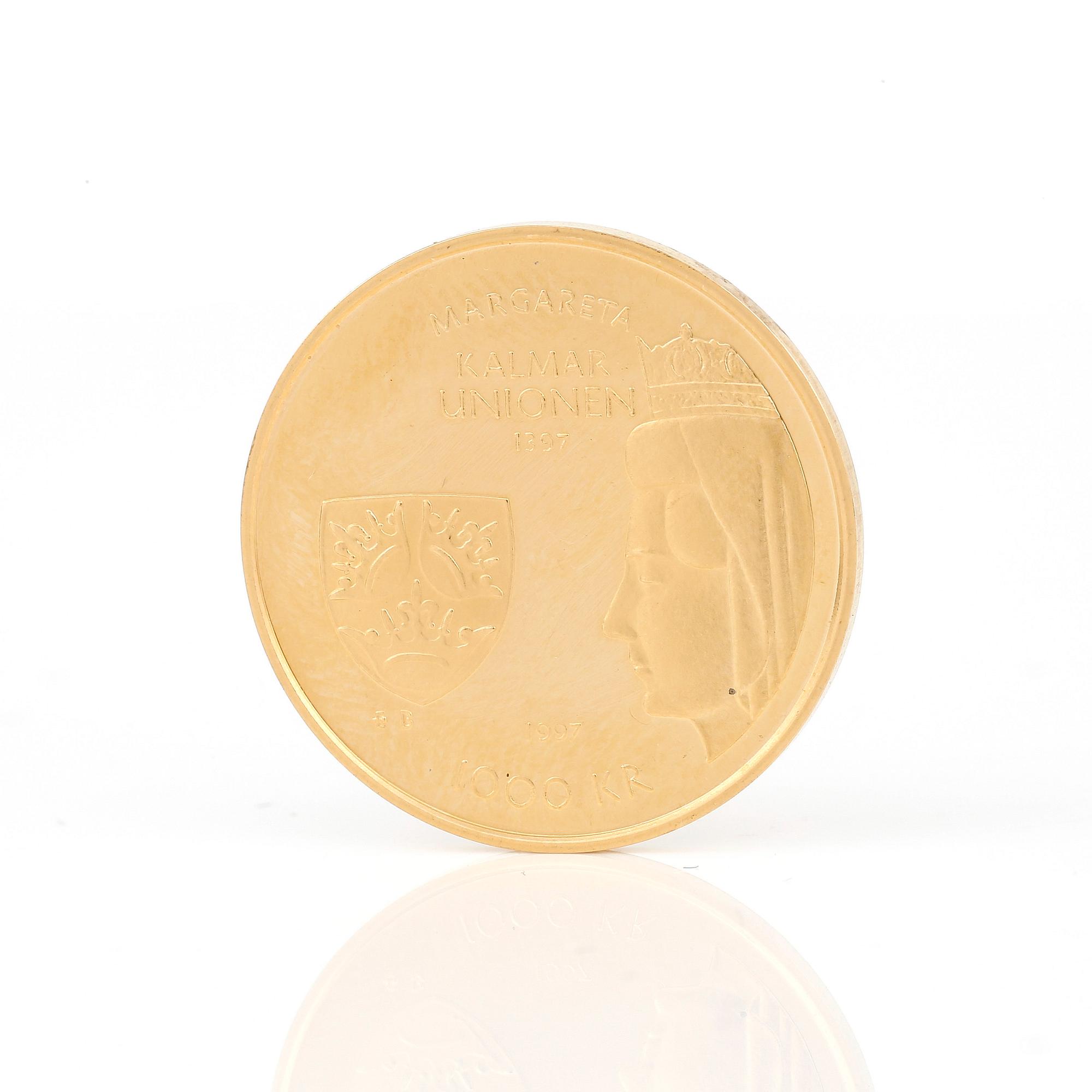GULDMYNT, jubileum, 1000 kronor, 18 karat guld. Kalmarunionen 1397-1997. Vikt 5,8 gram.