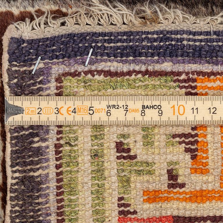 A Chinese two square rug, antique, c. 142 x 71 cm.