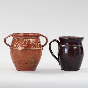 two earthenware pots from the 19th century.