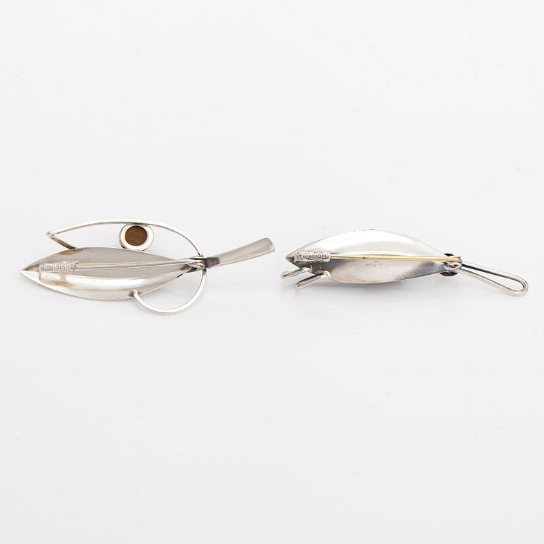Elis Kauppi, Two silver brooches, one with a tiger's eye. Kupittaan kulta, Turku 1959 and 1962.