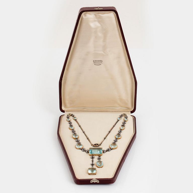 An aquamarine necklace in silver and 14K gold set with rose-cut diamonds.