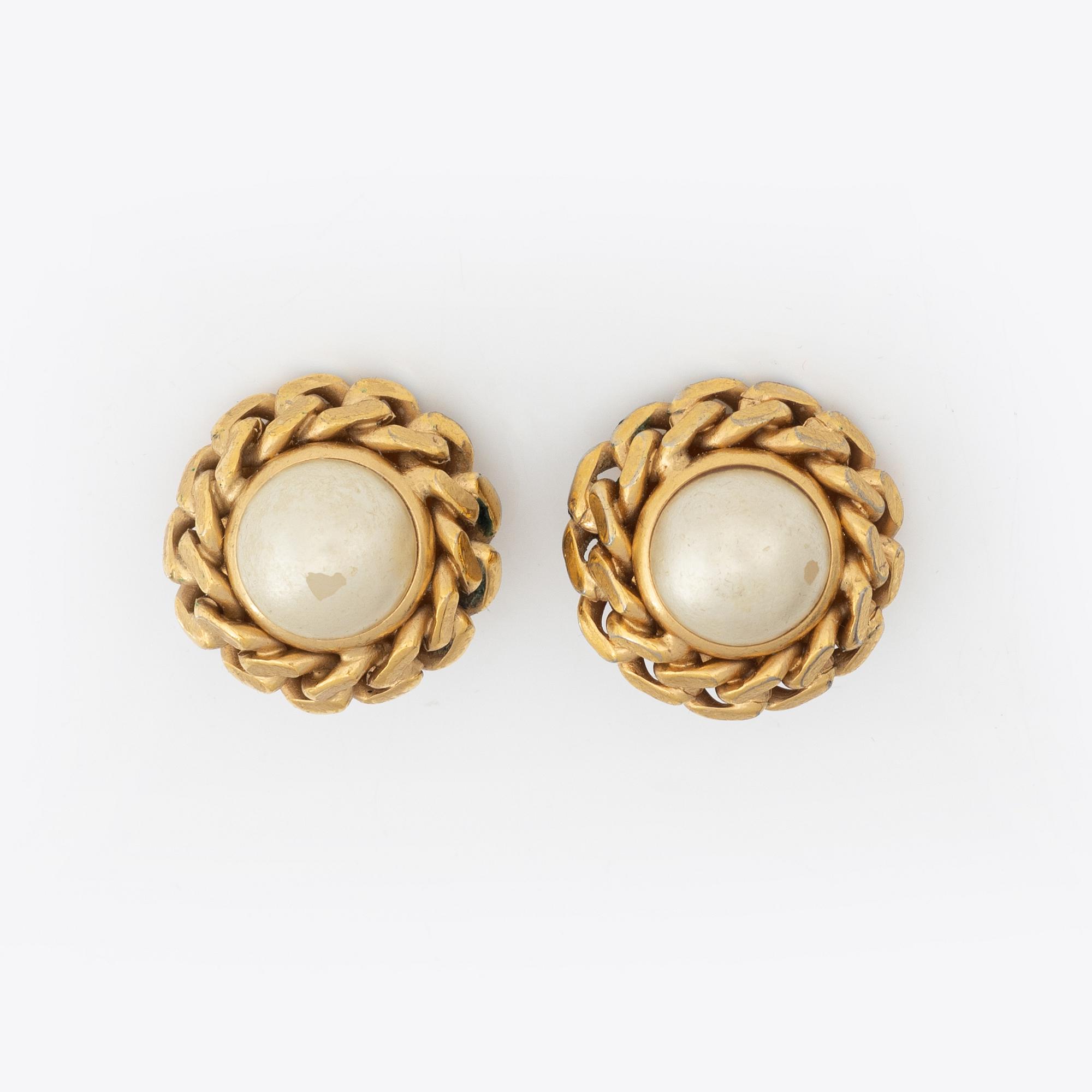 Céline, a pair of gold tone clip-on earrings.