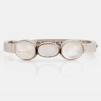 Wiwen Nilsson, a sterling silver bangle with three cabochon cut moonstones, Lund, Sweden 1938.