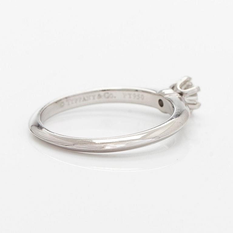 Tiffany & Co, a platinum solitaire ring with a brilliant-cut diamond.