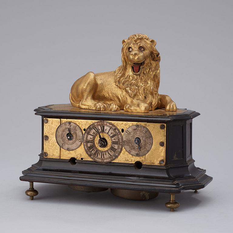 A rare gilt brass on ebonised base Lion Automaton figure clock, Augsburg circa 1630.