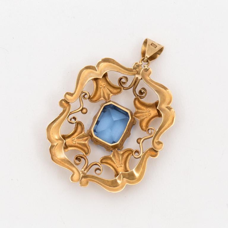 A pendant set with synthetic, blue spinel.