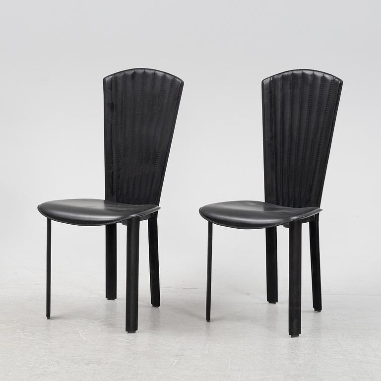 Twelve black leather 'Sossano' chairs, Quia, Italy.