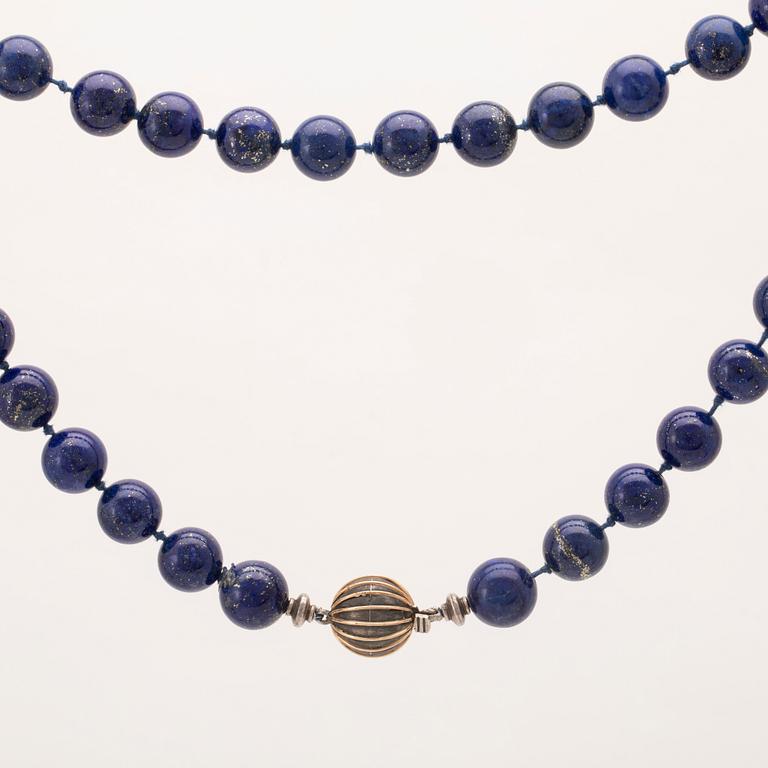 A collier of lapis lazuli and lock of partially gilded silver.