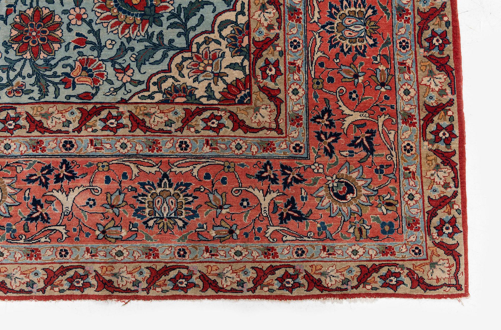 A semi-antique Qum carpet. Central Persia, c. 345 x 258 cm.