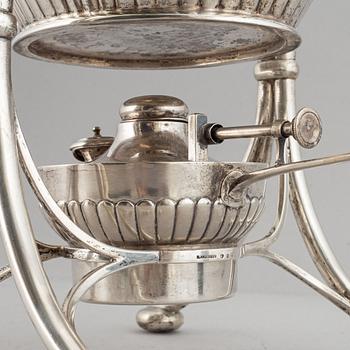 A swedish silver teapot with stand, K Andersson, Stockholm 1905.