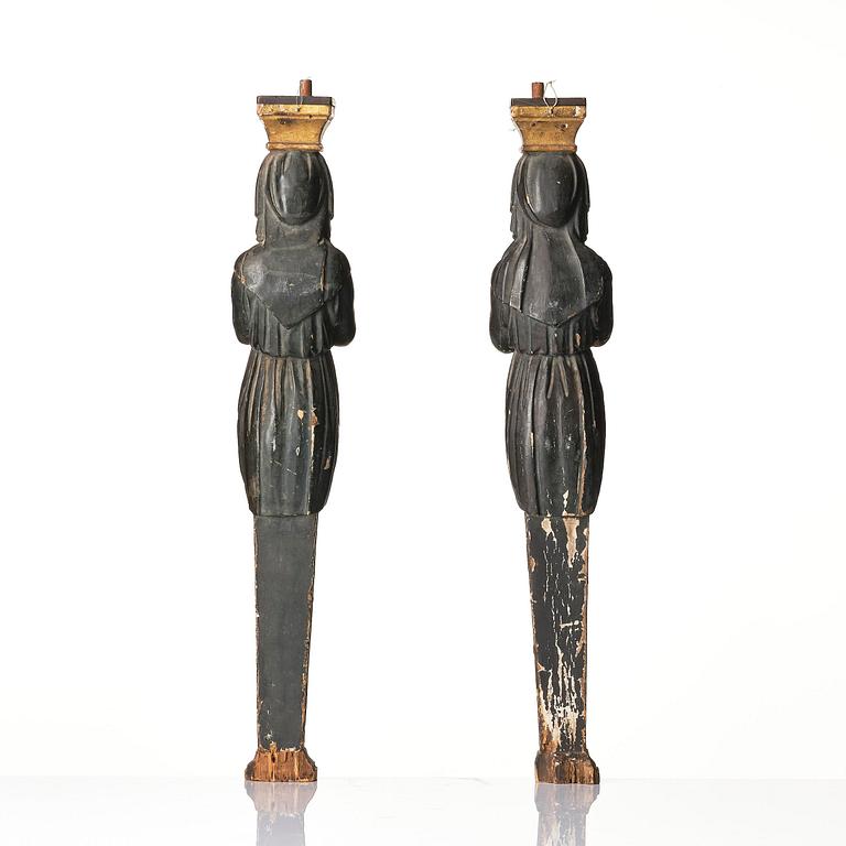 A pair of late Gustavian carved caryatids in the manner of Pehr Ljung (1743-1819) and Ernst Philip Thomann (1760-1833).
