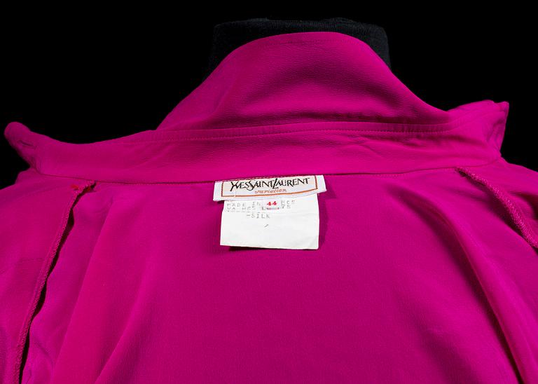 A 1980s cerise silk blouse by Yves Saint Laurent.