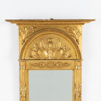 An Empire mirror, first half of the 19th Century.