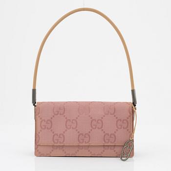 Gucci, a pink canvas handbag.