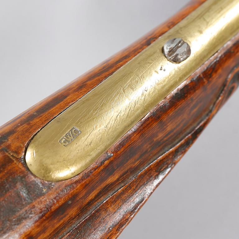 A flintlock rifle, 18th century.