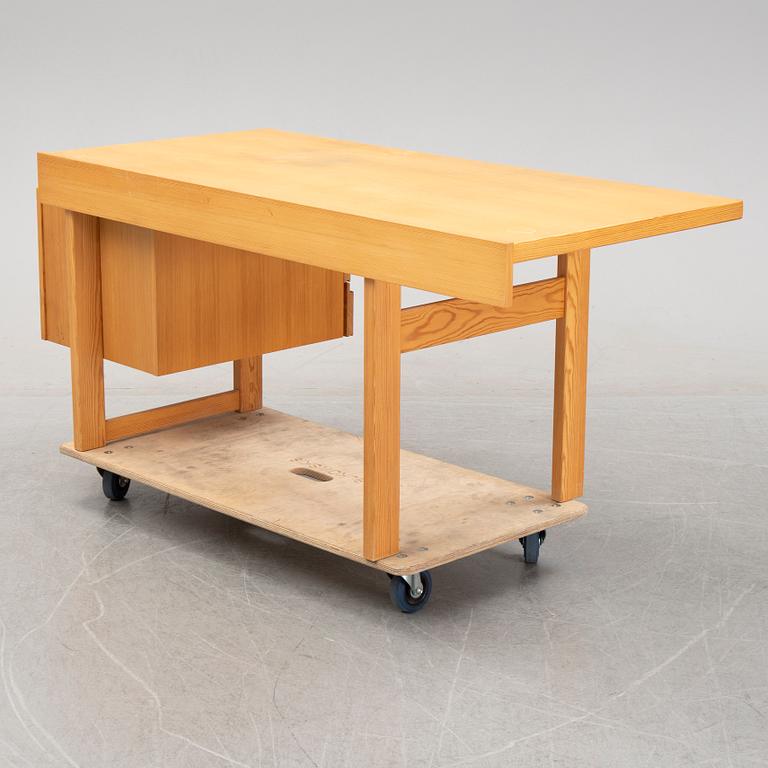 A pine writing desk by Olavi Hänninen for Nupponen, second half of the 20th Century.