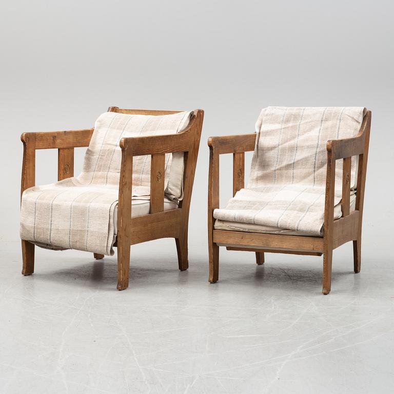 A pair of pine armchairs attributed to Carl Westman, early 20th Century.